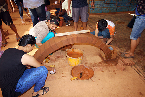 Trainees building an arch